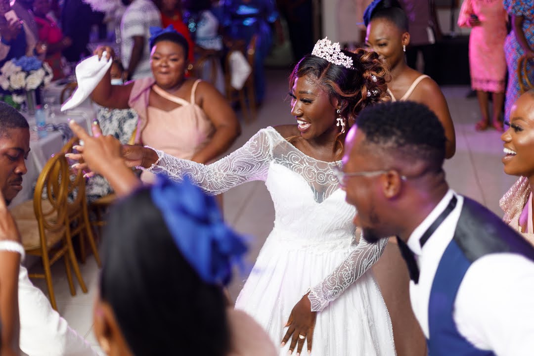 Bride celebrating with guests at a wedding reception