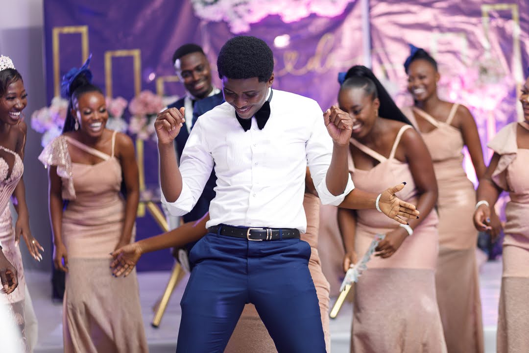 Groom dancing with the bridal party